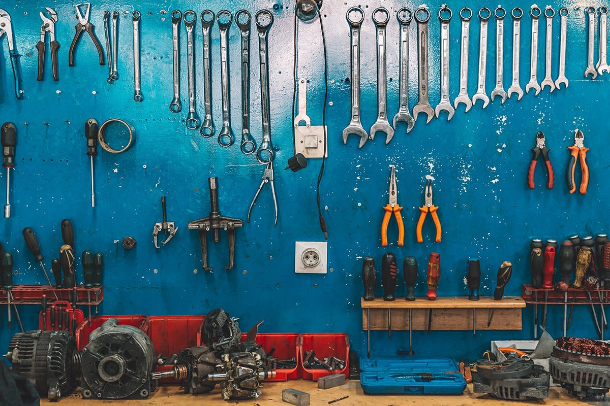 Wrenches are set up in a car repair garage.