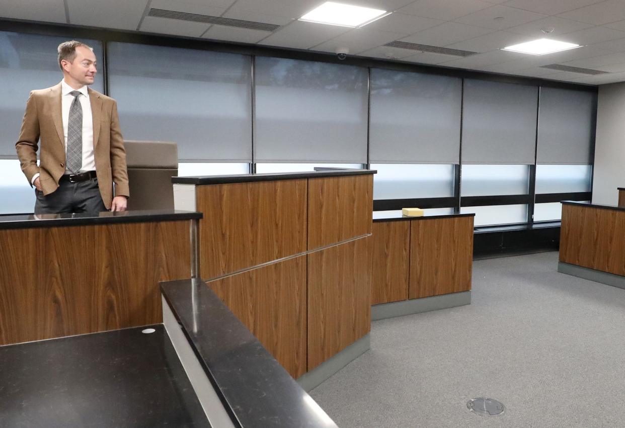 Judge Jon Oldham looks over his court room during a tour of the new Akron Municipal Court.