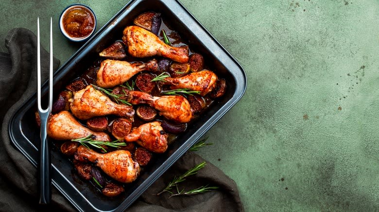 Chicken drumsticks in roasting tray