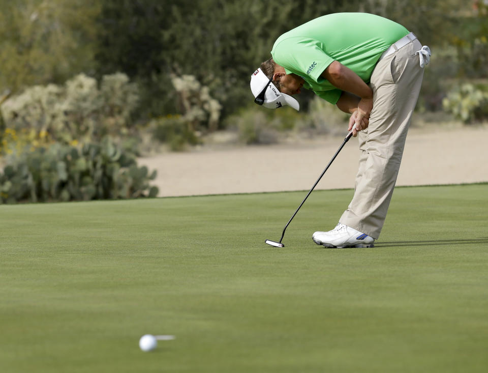 George Coetzee, of South Africa, reacts on the 17th hole, as he lost his third-round match against Jason Day, of the United States, at the Match Play Championship golf tournament Friday, Feb. 21, 2014, in Marana, Ariz. Day won 3 and 1. (AP Photo/Ted S. Warren)
