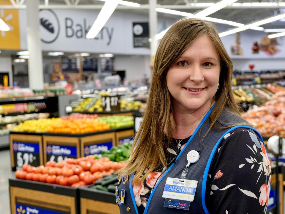 Walmart store People Lead Amanda Nelson graduated from the retailer's $1-a-day college program called Live Better U. 