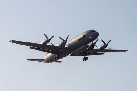 FILE PHOTO: A Russian Il-20 reconnaissance aircraft takes off from Central military airport in Rostov-on-Don, Russia March 6, 2014. Picture taken March 6, 2014. REUTERS/Sergey Pivovarov