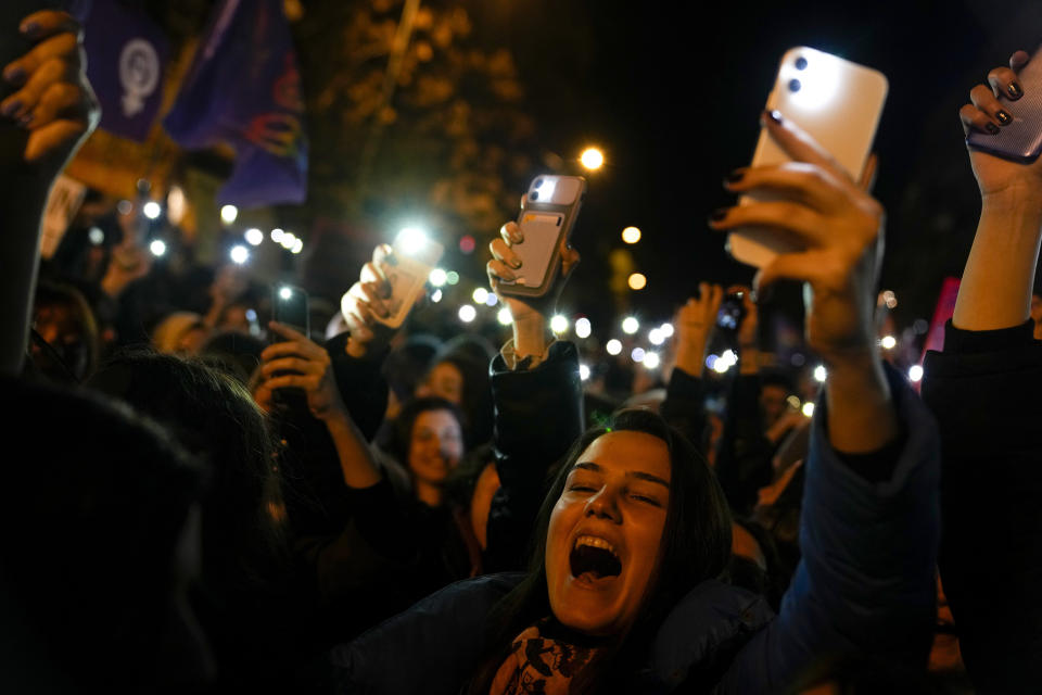 Women shout slogans as they gather to mark International Women's Day in Istanbul, Turkey, Wednesday, March 8, 2023. (AP Photo/Khalil Hamra)