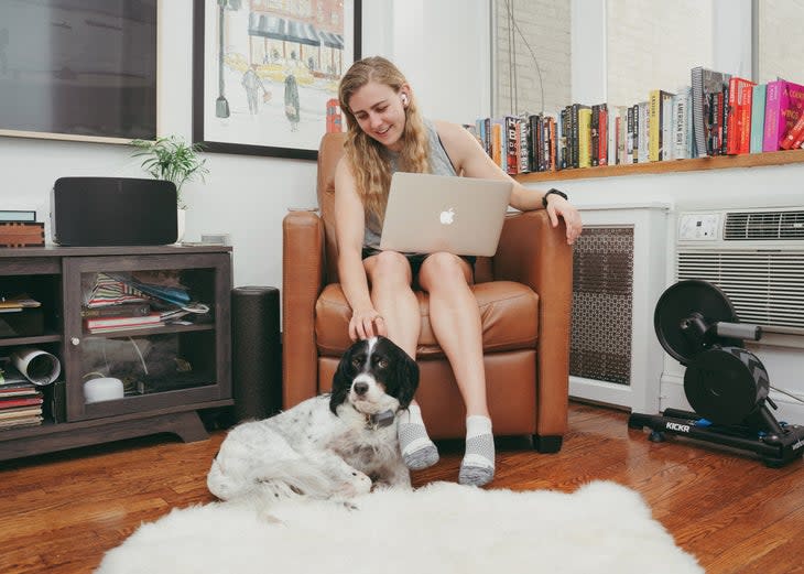 Mary Cain on her chair with her dog