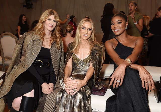 <p>Gilbert Flores/WWD via Getty</p> Laura Dern, Sheryl Crow and Gabrielle Union at Ralph Lauren's NYFW show on Sept. 8.