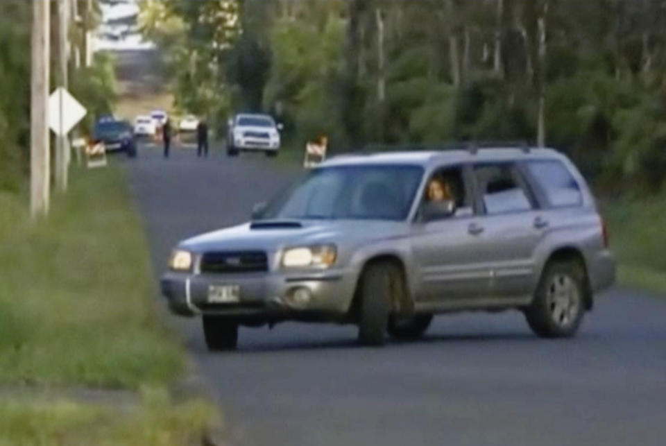 Road blocks in the area caused some drivers to make U-turns, after Hawaii County ordered evacuations for all of Leilani Estates, near Pahoa (KHON via AP)