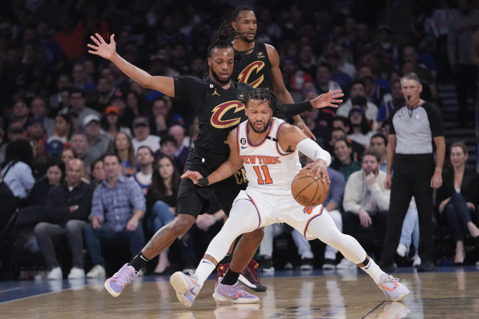 New York Knicks guard Jalen Brunson (11) drives against Cleveland Cavaliers guard Darius Garland in the first half of Game 4 in an NBA basketball first-round playoff series, Sunday, April 23, 2023, at Madison Square Garden in New York. (AP Photo/Mary Altaffer)