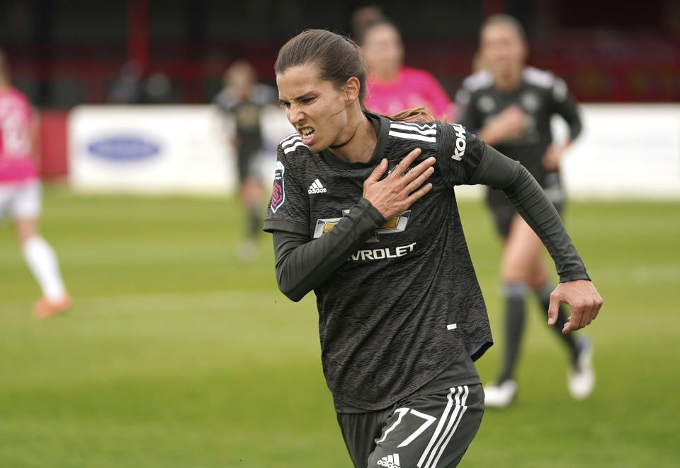 Manchester United's Tobin Heath celebrates scoring against West Ham United during the FA Women's Super League match at Victoria Road Stadium, London, Sunday Oct. 18, 2020. (John Walton/PA via AP)