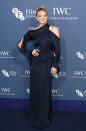 <p>The former ‘Game of Thrones’ star wowed in a midnight blue column dress featuring an asymmetric neckline. <em>[Photo: Getty]</em> </p>