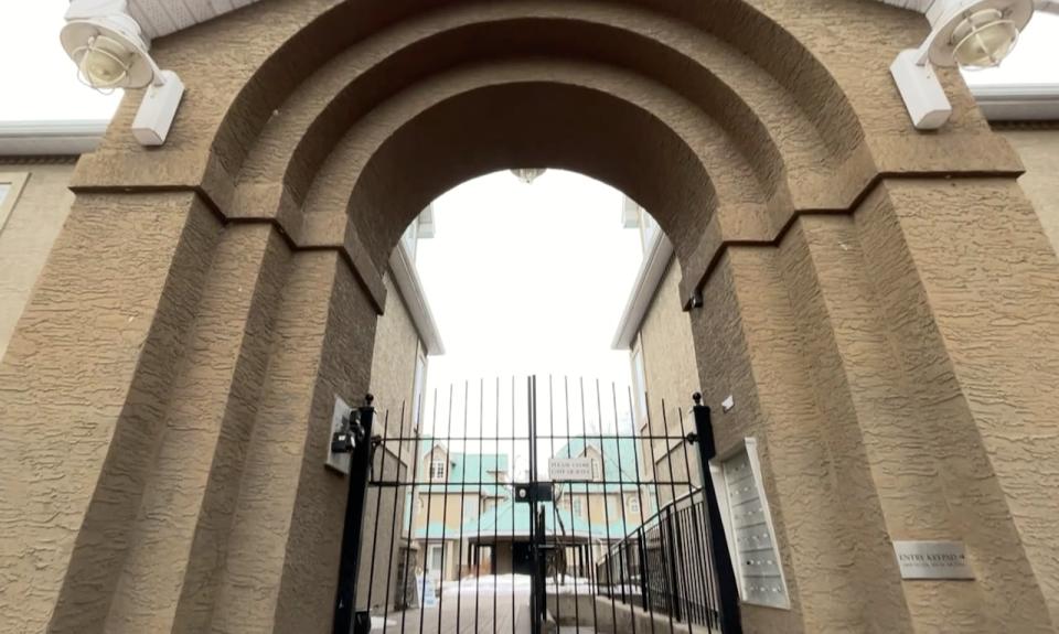 The main entrance to the River Run townhouse complex in downtown Calgary. The 23 townhomes will be demolished this year as the city begins construction on the Green Line LRT. (Bryan Labby/CBC - image credit)