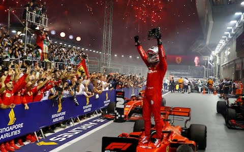 September 22, 2019 Ferrari's Sebastian Vettel celebrates after winning the race - Credit: REUTERS