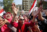 People chant pro-military slogans in Tahrir square as they celebrate the anniversary of an attack on Israeli forces during the 1973 war, in Cairo October 6, 2013. REUTERS/Mohamed Abd El Ghany (EGYPT - Tags: POLITICS CIVIL UNREST)