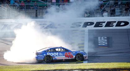 Bubba Wallace performs a burnout at Kansas