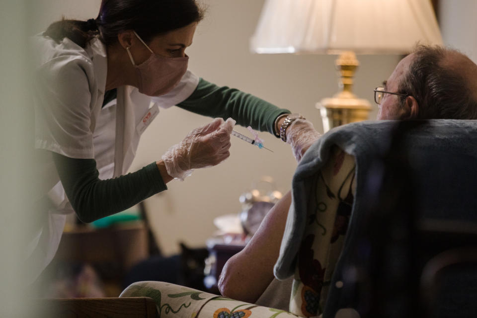 A CVS Health Corp. pharmacists administers a dose of the Moderna Covid-19 vaccine at the Covenant Place assisted living facility in Sumter, South Carolina on Jan. 26, 2021. (Micah Green/Bloomberg via Getty Images)