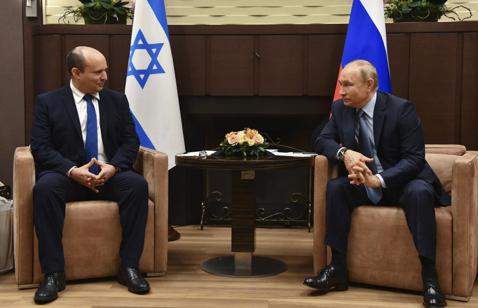 Russian President Vladimir Putin, right, and Israeli Prime Minister Naftali Bennett speak during their meeting in Sochi, Russia, Friday, Oct. 22, 2021. Russian President Vladimir Putin hosted Israeli Prime Minister Naftali Bennett Friday for their first meeting, hailing friendly ties between the two countries. (Evgeny Biyatov, Sputnik, Kremlin Pool Photo via AP)