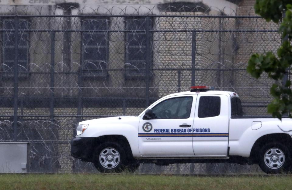 A Federal Bureau of Federal Prisons truck drives past barbed wire fences at the Federal Medical Center prison in Fort Worth, Texas, on May 16. Hundreds of inmates inside the facility have tested positive for COVID-19 and several inmates have died with numbers expected to rise.