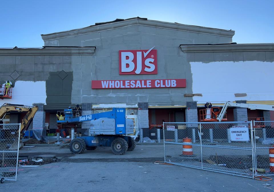 Workers paint the facade of the new store at Willowbrook Mall in Wayne on Nov. 14.