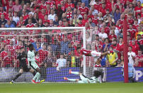 Nottingham Forest's Morgan Gibbs-White, top right, attempts a shot on goal during the English Premier League soccer match between Nottingham Forest and FC Chelsea in Nottingham, England, Saturday, May 11, 2024. (Mike Egerton/PA via AP)