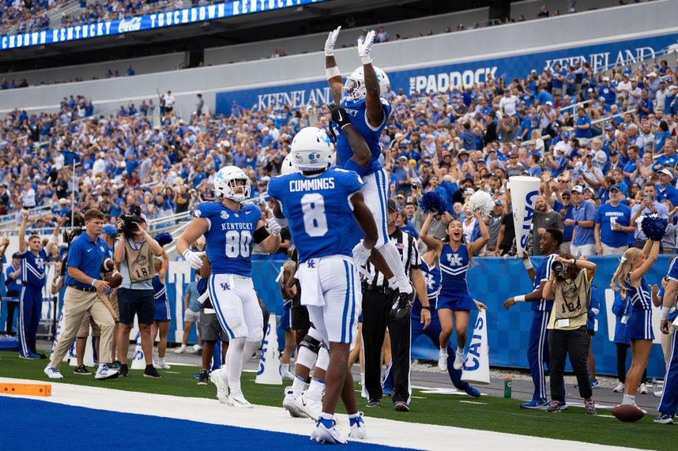 Kentucky running back Ray Davis is lifted in the end zone after scoring on a 24-yard touchdown pass during UK’s 28-17 win over Eastern Kentucky last week. Jack Weaver