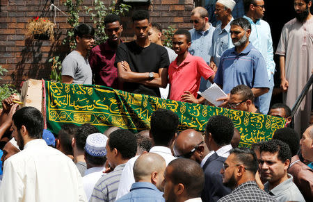 The casket of Abdirahman Abdi, a mentally ill black man who died following his arrest by police, is carried from the Ottawa Mosque after his funeral in Ottawa, Ontario, Canada, July 29, 2016. REUTERS/Chris Wattie