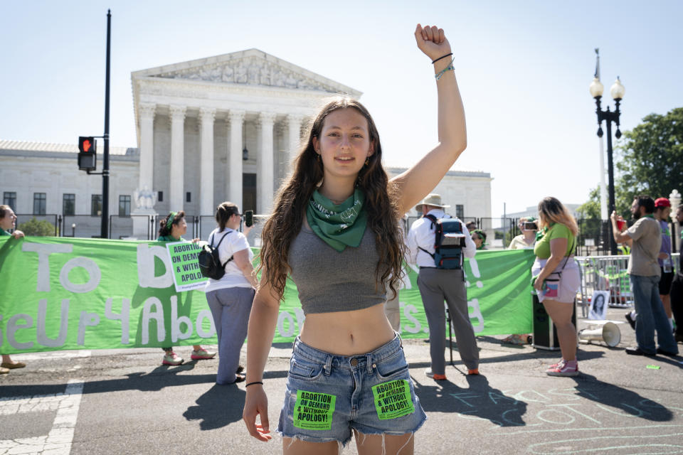 Beila Kraus, 15, of Chappaqua, N.Y., poses for a portrait while protesting outside the Supreme Court about abortion, Wednesday, June 15, 2022, in Washington. "This will affect the rest of my life and the rest of so many people with uteruses lives," she said. "What future am I working towards if I don't have bodily autonomy and if politicians have control over my body?" Kraus said, "Being outside the Supreme Court, for me it's representation as the people making this decision are in there. It's this image of the power that these Justices hold." (AP Photo/Jacquelyn Martin)
