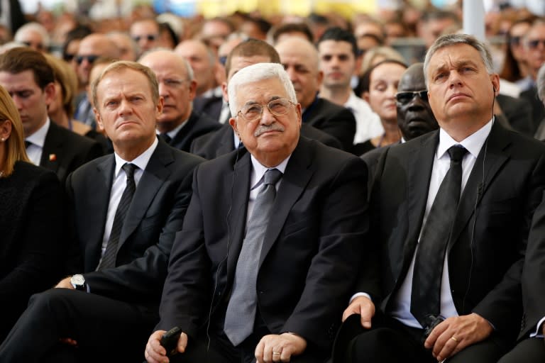 Palestinian president Mahmud Abbas (C) sits alongside European Council President Donald Tusk (L) and Hungarian Prime Minister Viktor Orban during the funeral of former Israeli president and prime minister Shimon Peres