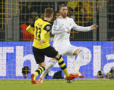 Dortmund's Marco Reus scores his side's opening goal during the Champions League quarterfinal second leg soccer match between Borussia Dortmund and Real Madrid in the Signal Iduna stadium in Dortmund, Germany, Tuesday, April 8, 2014. (AP Photo/Frank Augstein)