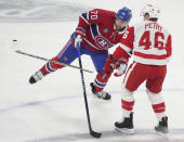 Detroit Red Wings' Jeff Petry (46) breaks his stick as he works against Montreal Canadiens' Tanner Pearson (70) during the first period of an NHL hockey game Tuesday, April 16, 2024, in Montreal. (Christinne Muschi/The Canadian Press via AP)
