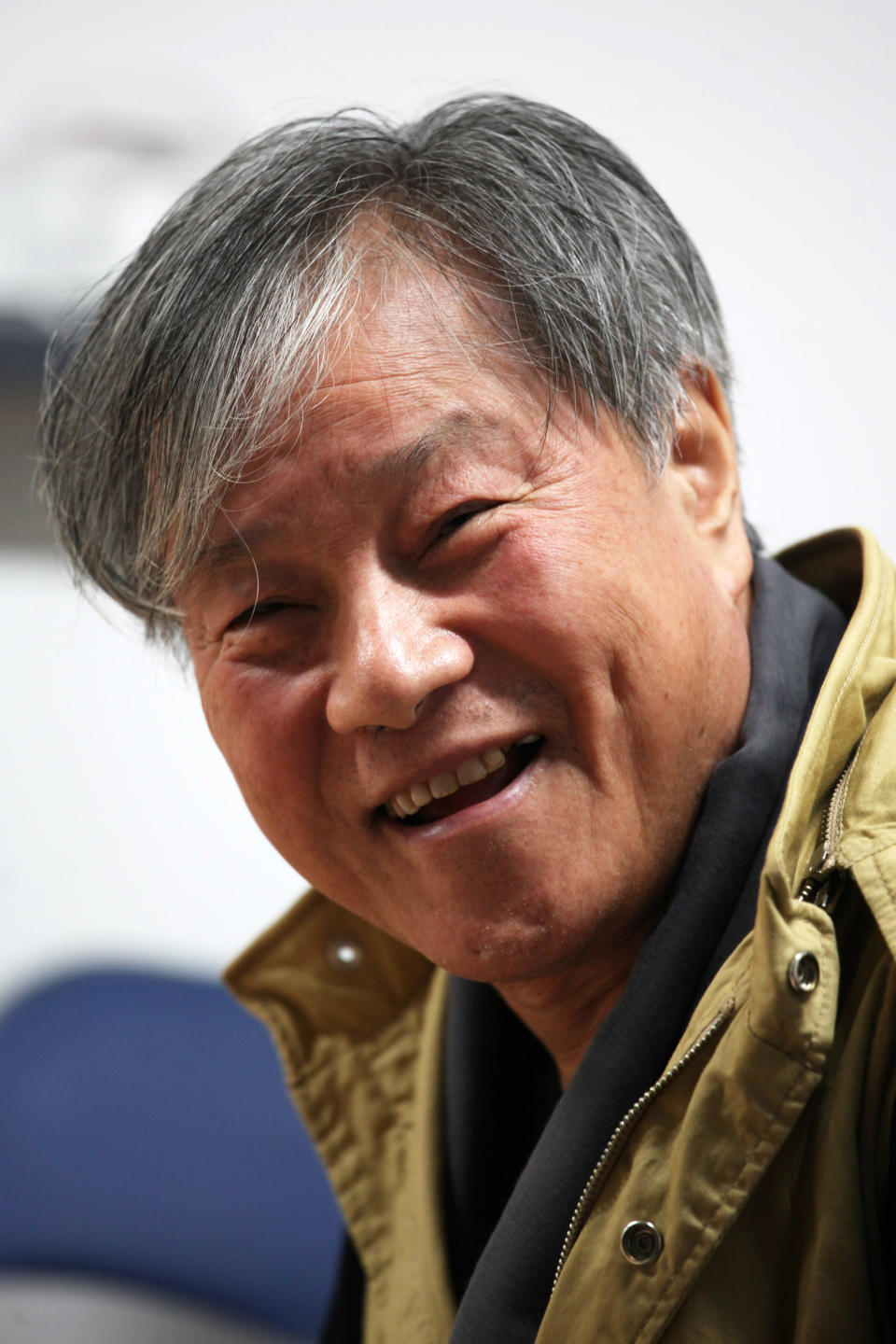 In this Friday, Oct. 4, 2013 photo, South Korean director Lee Jang-ho smiles before the screening of his film "God's Eye View" at Megabox Haeundae Theater during Busan International Film Festival in Busan, South Korea. The new drama by Lee, well-known in South Korea for his commercial movies in the 1970s and the 1980s, borrows from true events to examine religious conviction in a country that sends out many of the world’s Christian missionaries. The film portrays Christian volunteers kidnapped by Muslim rebels while on an evangelical mission in a fictional Islamic country. The film directly references the 2007 crisis in which 23 members of Saemmul Presbyterian Church were taken as hostages by the Taliban in Afghanistan in 2007, and two of them were killed. (AP Photo/Woohae Cho)