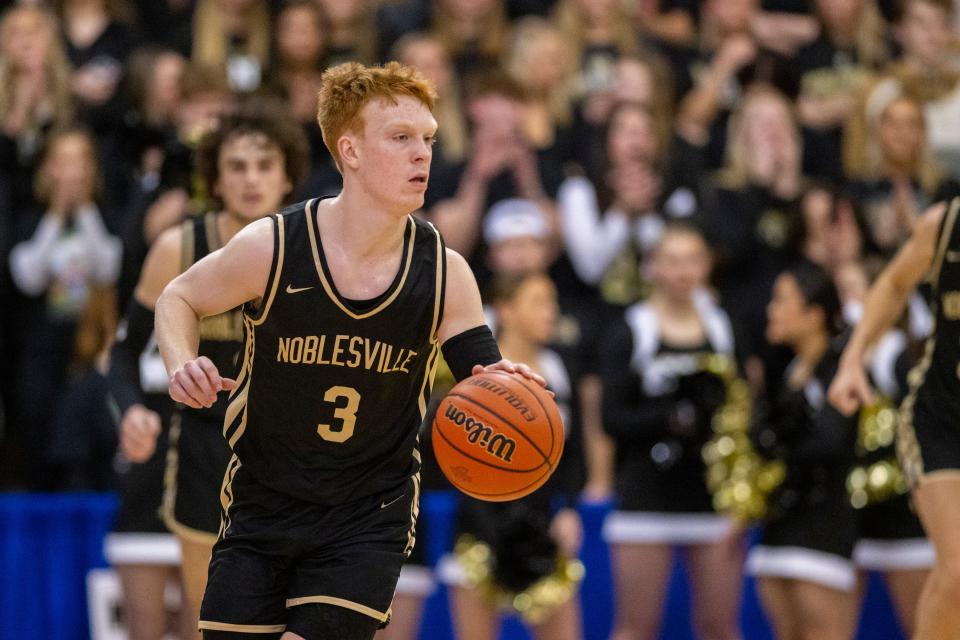 Noblesville High School junior Aaron Fine (3) brings the ball up court during the first half of an IHSAA Sectional basketball game against Westfield High School, Friday, March 3, 2023, at Carmel High School.