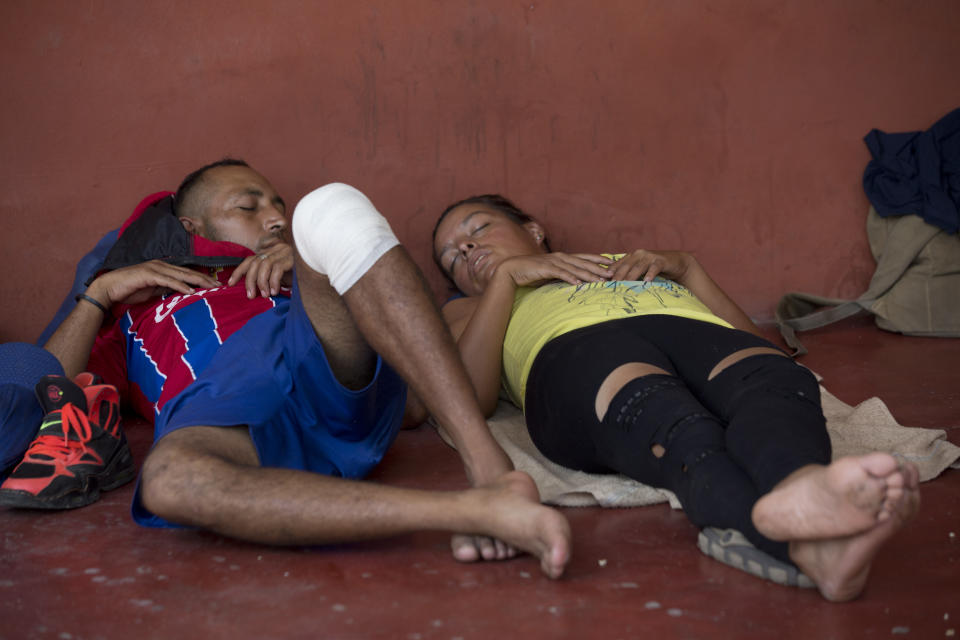 Central American migrants traveling in a caravan to the U.S. rest in the San Francisco Catholic church in Tonala, Chiapas State, Mexico, Tuesday, April 23, 2019. Central American migrants traveling through southern Mexico toward the U.S. on Tuesday fearfully recalled their frantic escape from police the previous day, scuttling under barbed wire fences into pastures and then spending the night in the woods after hundreds were detained in a raid. (AP Photo/Moises Castillo)