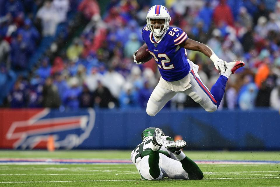 Buffalo Bills running back T.J. Yeldon (22) hurdles New York Jets strong safety Jamal Adams, bottom, during the second half of an NFL football game Sunday, Dec. 29, 2019, in Orchard Park, N.Y. (AP Photo/David Dermer)