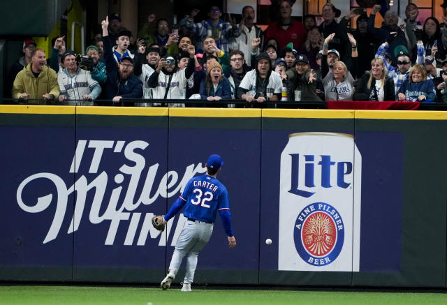 Seattle Mariners' J.P. Crawford holds a trident after hitting a solo home  run against the Oakland Athletics during the ninth inning of a baseball  game Tuesday, Sept. 19, 2023, in Oakland, Calif. (