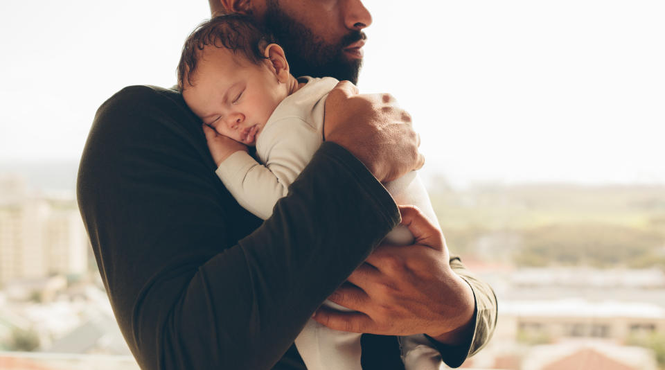 A man holding a baby