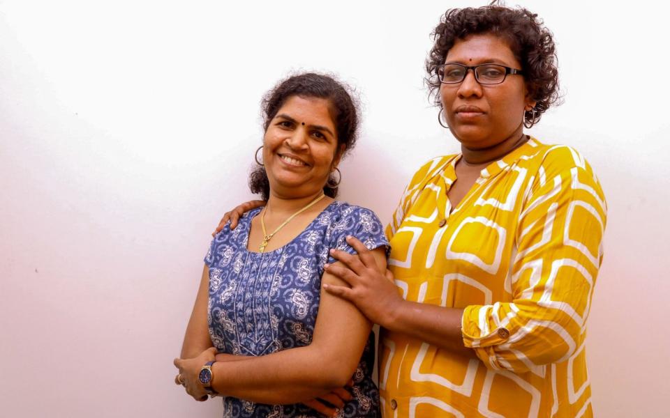 Bindu Ammini (R) and Kanaka Durga (L), the two Indian women who entered the Sabarimala Ayyapa temple, pose for photographs during an interview  - AFP