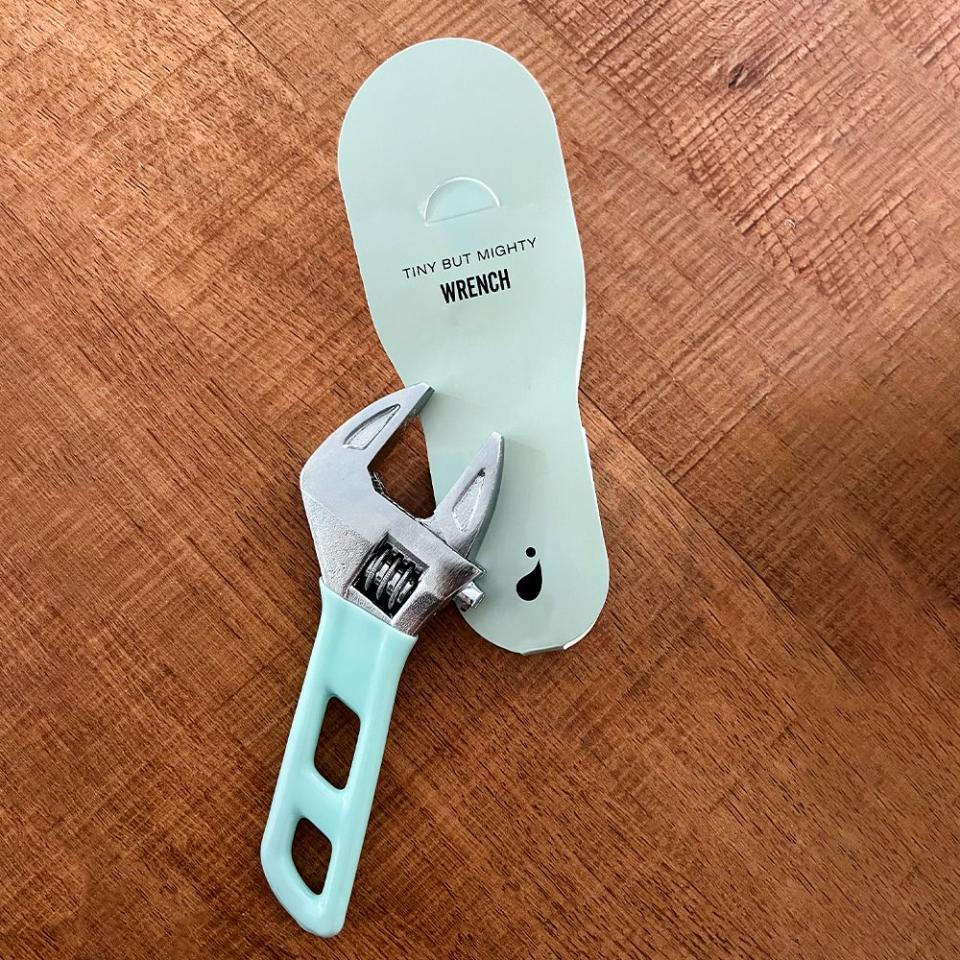 a small tiny but mighty mint green wrench