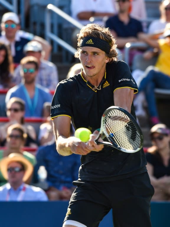 Alexander Zverev of Germany hits a return against Roger Federer of Switzerland during their ATP Rogers Cup final match, at Uniprix Stadium in Montreal, Quebec, on August 13, 2017