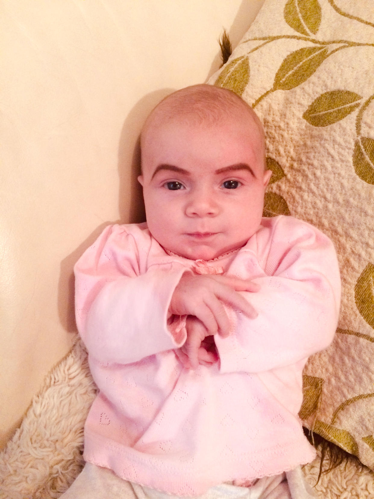 Little Isabella was given a bold new set of eyebrows by her mum [Photo: Caters]