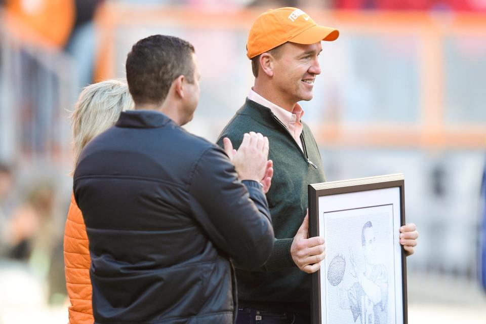 Peyton Manning is honored during an SEC football homecoming game between the Tennessee Volunteers and the Georgia Bulldogs in Neyland Stadium in Knoxville on Saturday, Nov. 13, 2021.