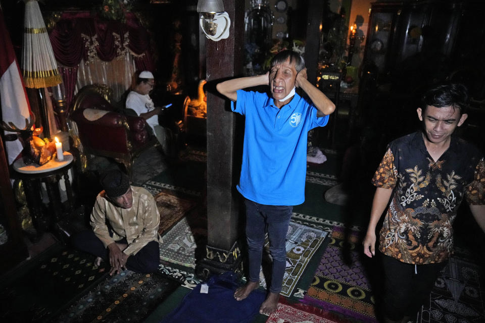 A trans woman chants the call for prayer before an early evening prayer at Al-Fatah Islamic school in Yogyakarta, Indonesia, Sunday, Nov. 6, 2022. On the outskirts of the Indonesian city that's home to many universities, the small boarding school is on a mission that seems out of place in a nation with more Muslim citizens than any other. Its students are transgender women. (AP Photo/Dita Alangkara)