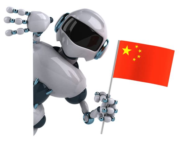 A robot holding a Chinese flag.