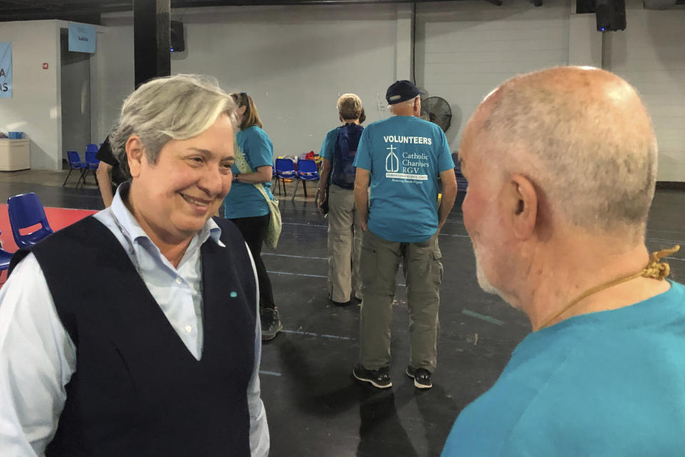 In this Feb. 17, 2020 photo, Sister Norma Pimentel, head of Catholic Charities in the Diocese of Brownsville, Texas, greets a volunteer at the migrant respite center she runs in McAllen, Texas. "We talk about being pro-life, and we're OK returning families to places where they could be killed?" she said. "We need to hold our fellow Catholics more accountable." (AP Photo/David Crary)