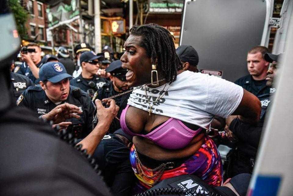 Qween Jean, a transgender rights activist, is arrested May 31, 2023, during a trans-rights demonstration in New York City. <a href="https://www.gettyimages.com/detail/news-photo/queen-jean-is-arrested-during-a-weekly-protest-in-support-news-photo/1258341307" rel="nofollow noopener" target="_blank" data-ylk="slk:Stephanie Keith/Getty Images;elm:context_link;itc:0;sec:content-canvas" class="link ">Stephanie Keith/Getty Images</a>