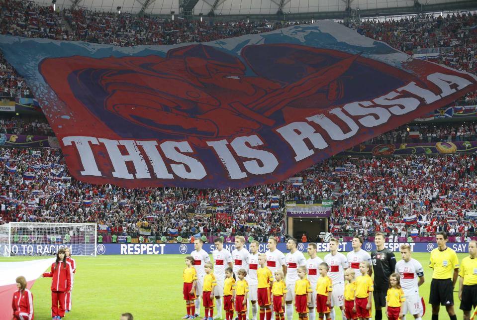 Russian fans unfurl a giant banner declaring 'This is Russia' inside the National Stadium, Warsaw.