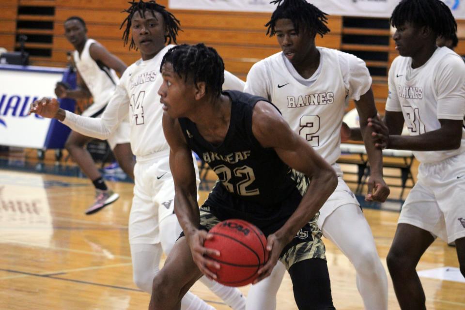 Oakleaf center Cameron Coachman (32) pulls down a rebound. The senior was one of two Knights selected to Clay County's All-County boys basketball team.