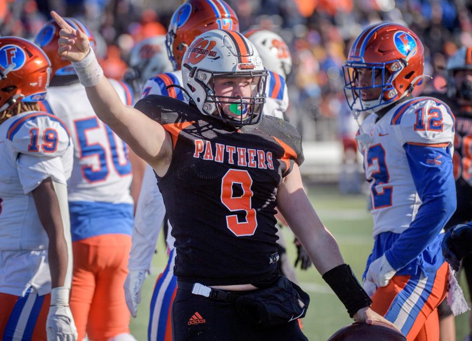 Washington quarterback Tyler Humphrey signals a first down after his run against East St. Louis in the first half of their Class 6A football state semifinal game Saturday, Nov. 18, 2023 at Babcook Field in Washington.