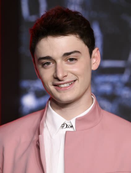 &quot;Stranger Things&quot; star Noah Schnapp in a white shirt and pink blazer