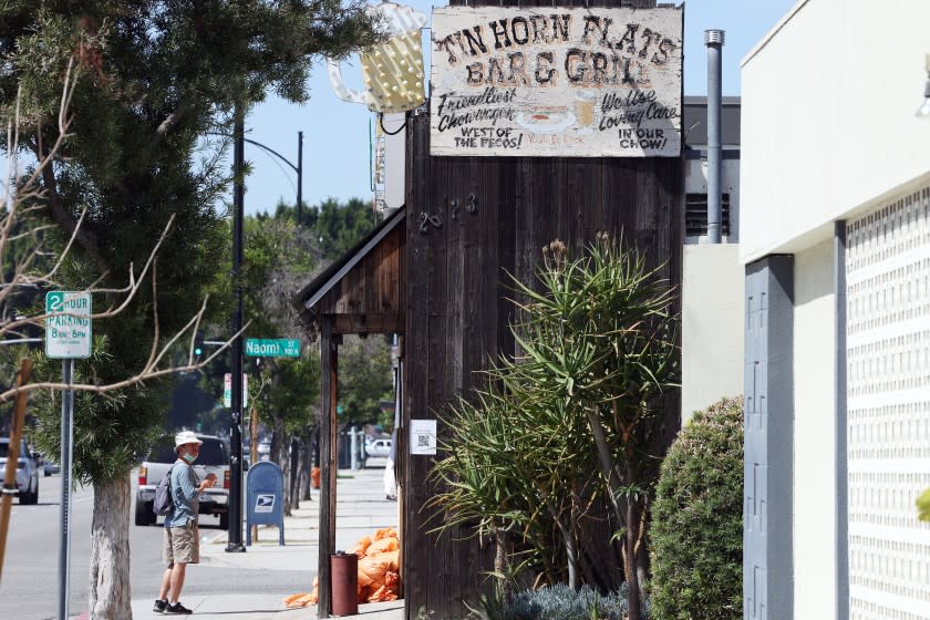 LOS ANGELES, CA - APRIL 07: Sandbags are seen in front of Tinhorn Flats restaurant which has continued to defy coronavirus health orders to close in Burbank on Wednesday, April 7, 2021 in Los Angeles, CA. The co-owner has been arrested for removing the sandbags the city has placed to block the front doors. (Dania Maxwell / Los Angeles Times)