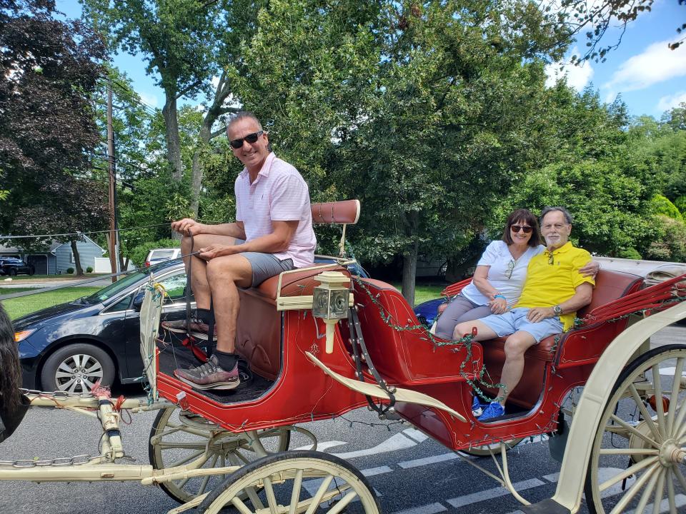 Forrest and Diane Elliott in the carriage during a July picnic to raise funds for Ukraine.