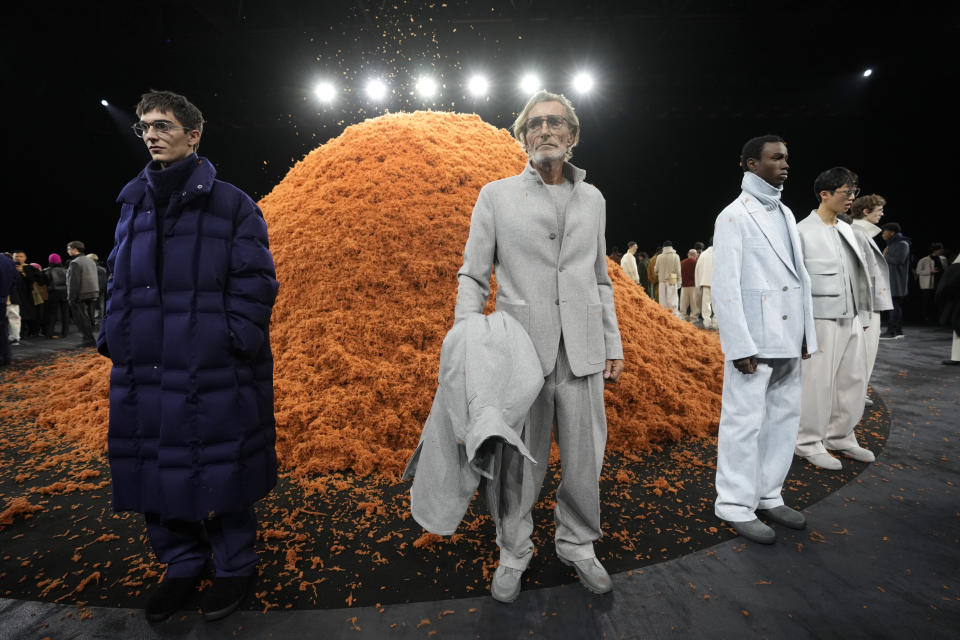 Models wear creations part of the Zegna men's Fall-Winter 2024-2025 collection, that was presented in Milan, Italy, Monday, Jan. 15, 2024. (AP Photo/Luca Bruno).